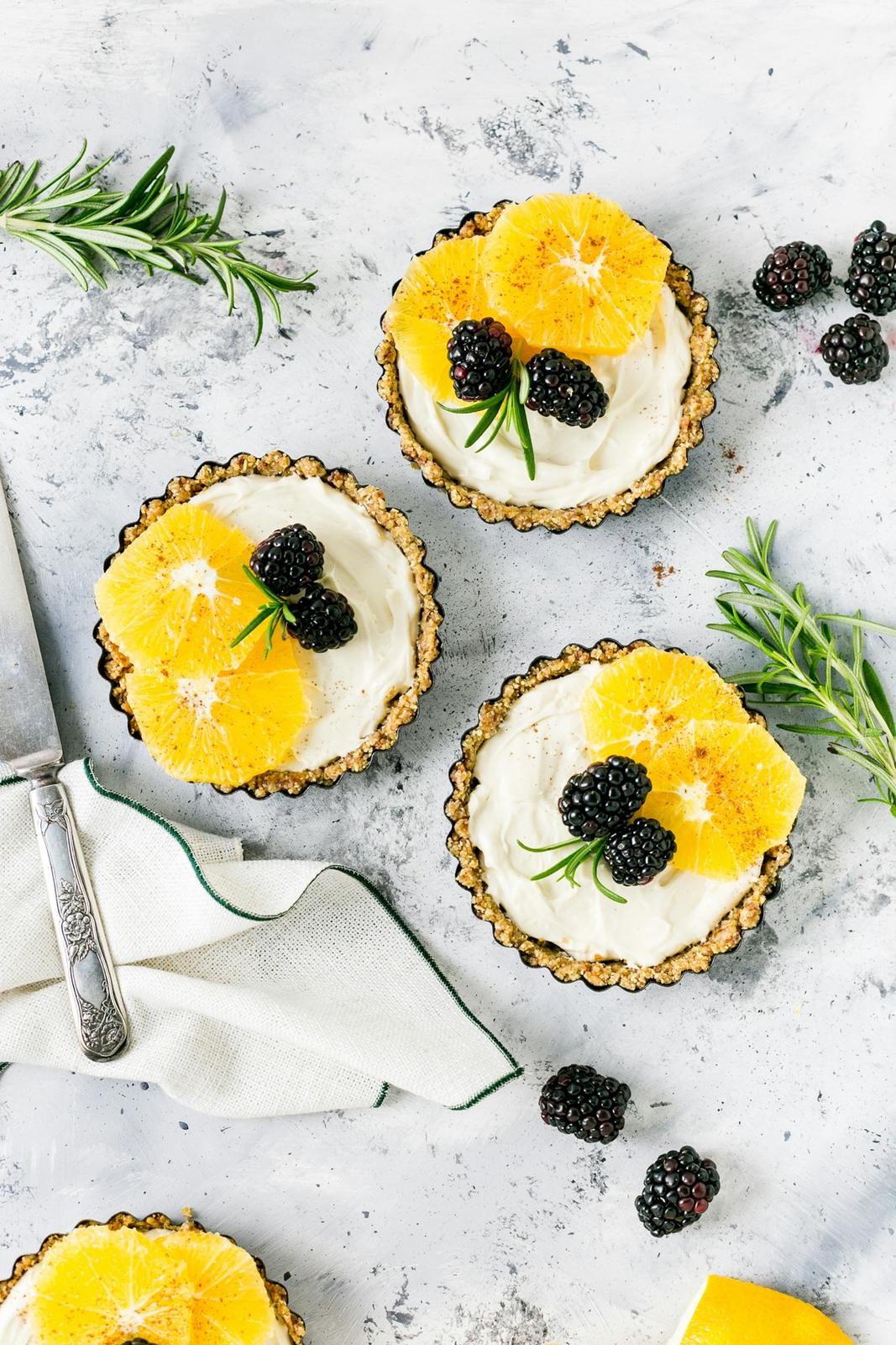 Little lemon tarts topped with blackberries