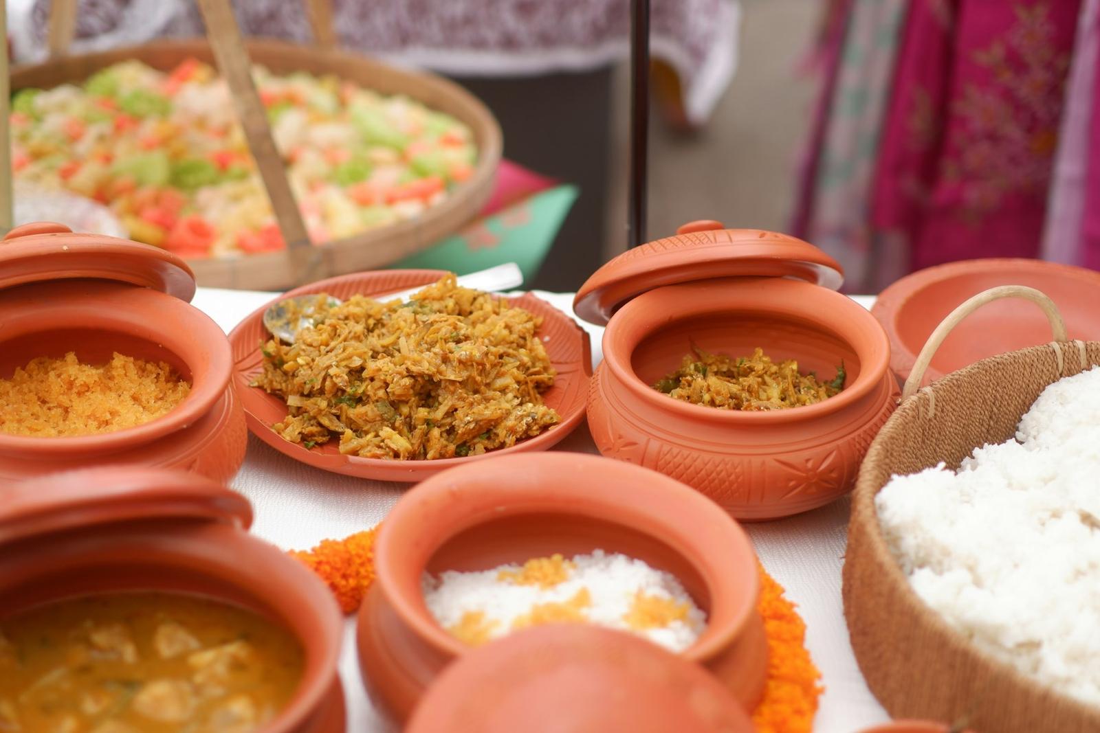 A wedding buffet laid out in clay handis