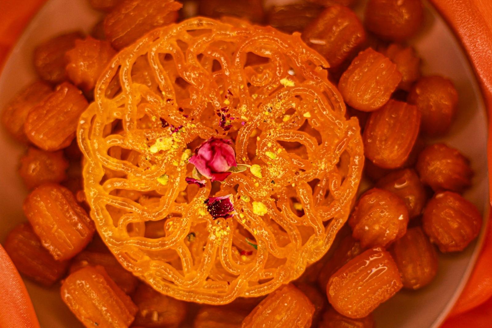 A jalebi crowned with a rosebud